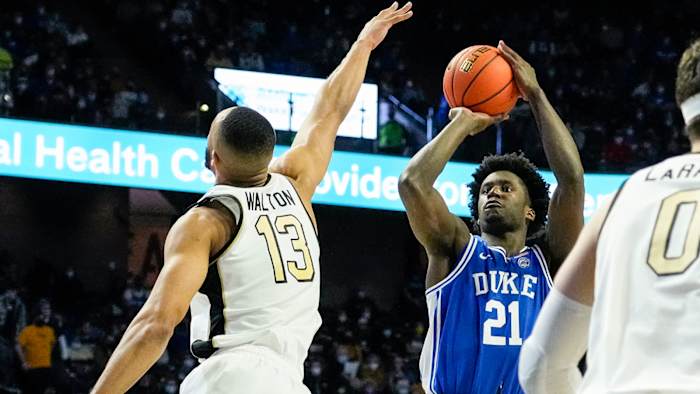 Duke Blue Devils forward A.J. Griffin (21) shoots over Wake Forest Demon Deacons forward Dallas Walton.